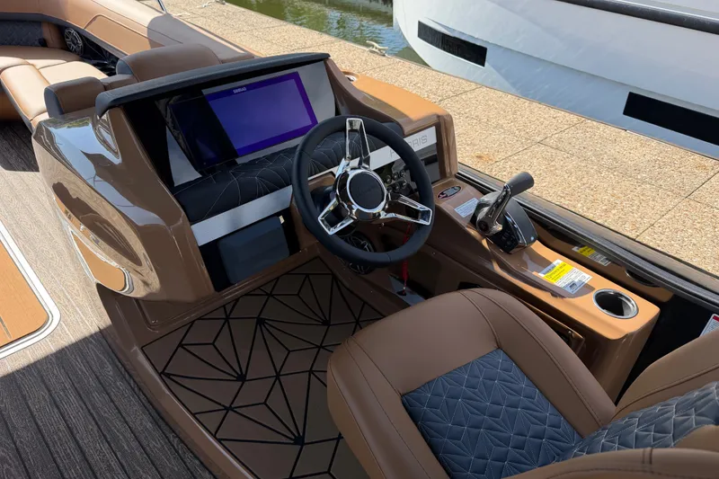 Slide: The Image of 2027 Harris Grand Mariner 250 SLDH boat cockpit with modern steering and control panel. - 6