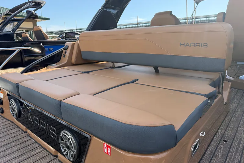 Slide: The Image of 2027 Harris Grand Mariner 250 SLDH boat with tan seating and sleek design. - 4