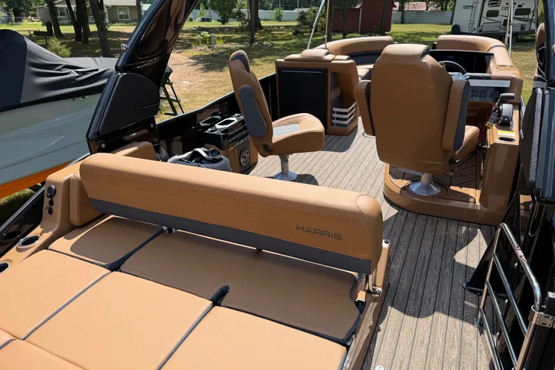 Slide: The Image of Luxurious interior of 2027 Harris Grand Mariner 250 SLDH pontoon boat with tan seating. - 16