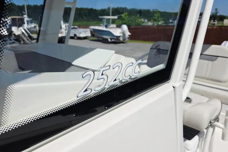 Slide: The Image of 2027 Sailfish 252 CC boat window with model number in focus. - 15