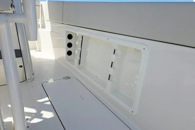 Slide: The Image of Interior view of a modern boat with white seating and storage area. - 17