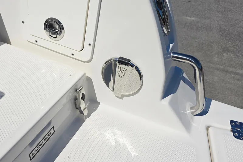 Slide: The Image of 2027 Sailfish 252 CC boat detail showing seacock access and stainless steel handle. - 18