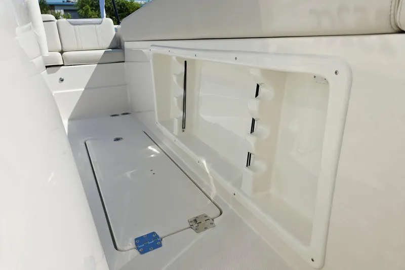 Slide: The Image of Interior view of a boat with storage compartment and seating area. - 14