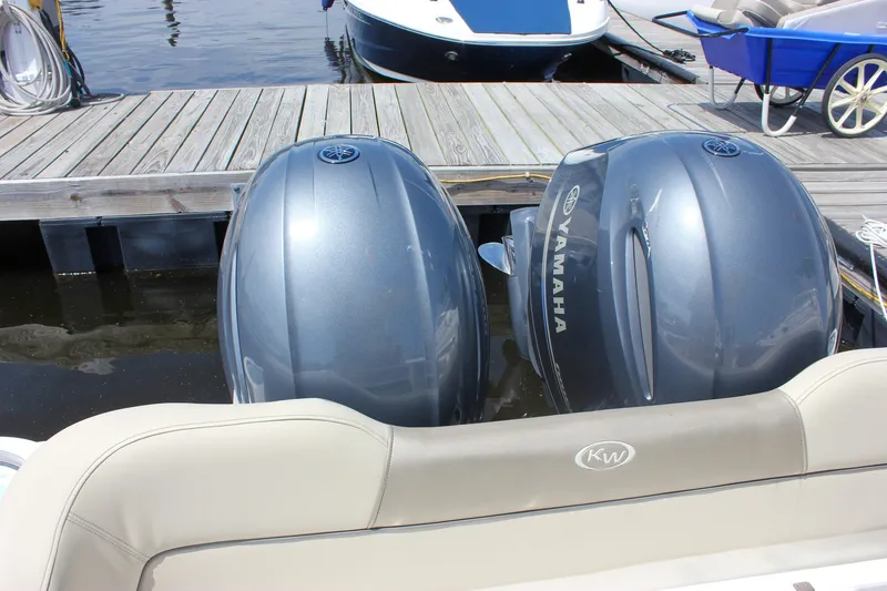 Slide: The Image of 2022 Key West 263 FS boat with twin Yamaha outboard motors at dock. - 29