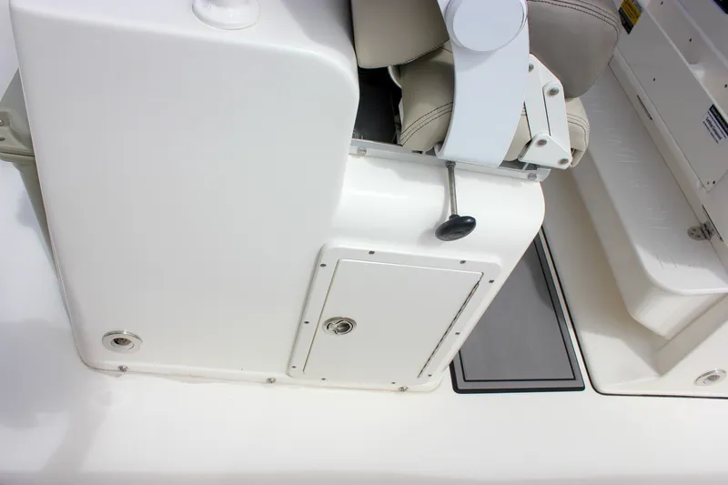 Slide: The Image of 2022 Key West 263 FS boat interior, featuring a white console and seating area. - 36
