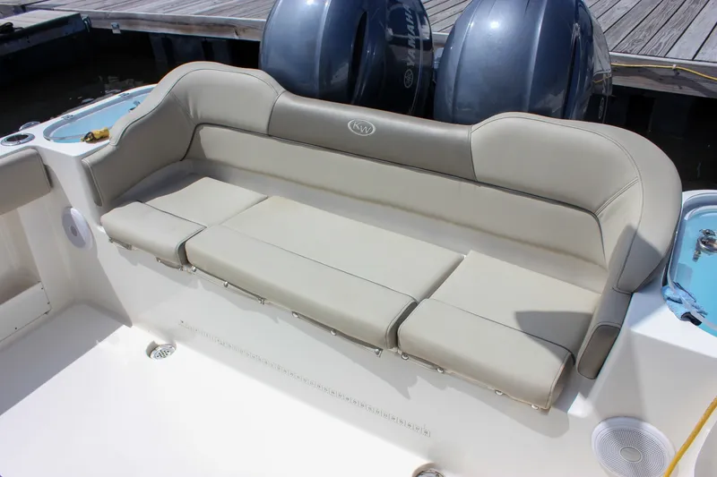 Slide: The Image of 2022 Key West 263 FS boat with comfortable beige seating and dual engines. - 31