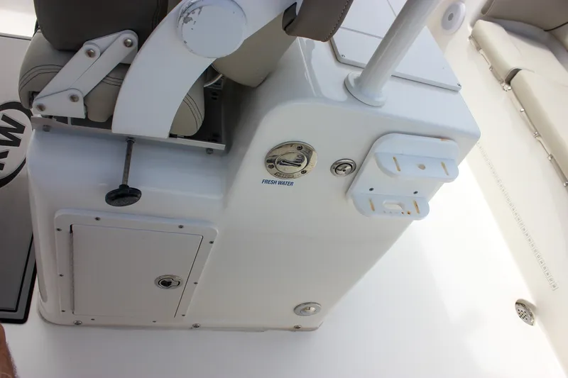 Slide: The Image of 2022 Key West 263 FS boat interior, featuring seating and fresh water access. - 35