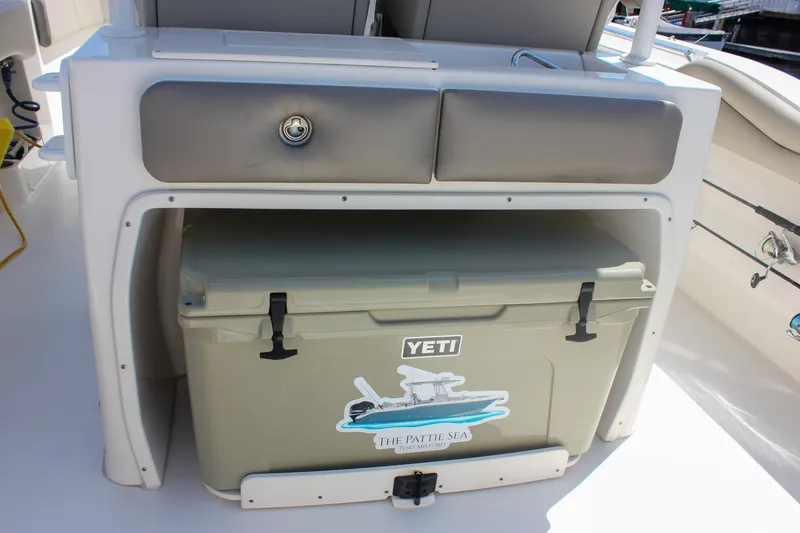 Slide: The Image of 2022 Key West 263 FS boat with Yeti cooler storage compartment. - 12