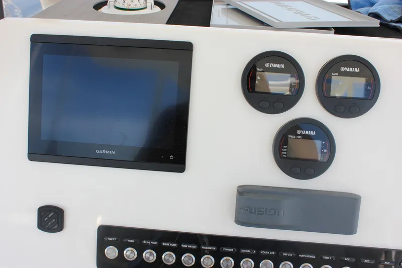 Slide: The Image of Dashboard of 2022 Key West 263 FS boat with Garmin and Yamaha displays. - 22