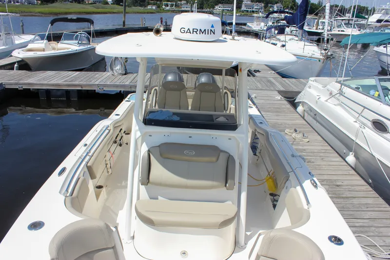 Slide: The Image of 2022 Key West 263 FS boat docked, featuring Garmin navigation system. - 28