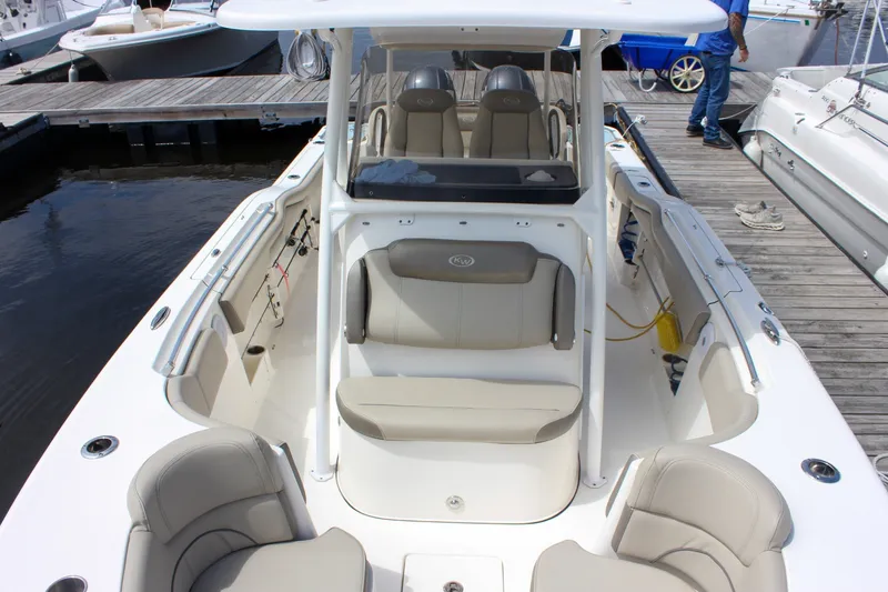 Slide: The Image of 2022 Key West 263 FS boat interior with seating, docked at marina. - 34