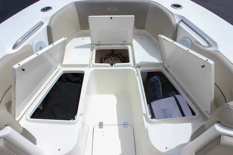 Slide: The Image of 2022 Key West 263 FS boat storage compartments open, showcasing spacious interior design. - 40