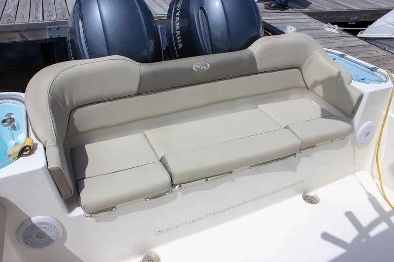Slide: The Image of 2022 Key West 263 FS boat with beige seating and Yamaha engines. - 30