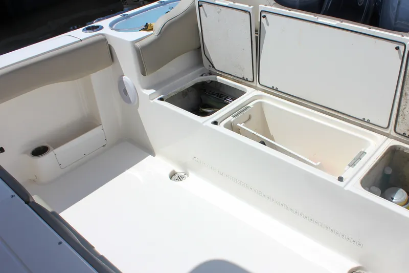 Slide: The Image of 2022 Key West 263 FS boat interior with open storage compartments. - 9
