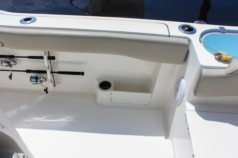 Slide: The Image of Interior view of 2022 Key West 263 FS boat with fishing rod holders and seating. - 14