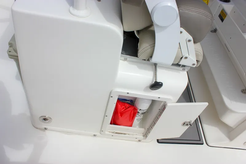 Slide: The Image of 2022 Key West 263 FS boat storage compartment with safety equipment. - 37