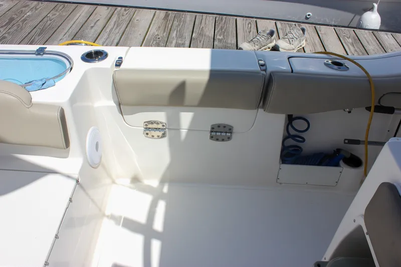 Slide: The Image of Interior of 2022 Key West 263 FS boat with seating and storage compartments. - 16