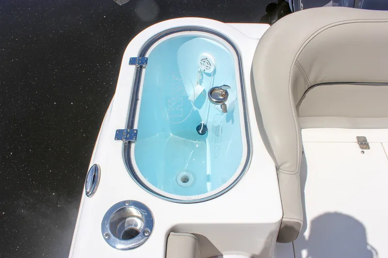 Slide: The Image of 2022 Key West 263 FS boat livewell and seating area, featuring sleek design and functionality. - 10