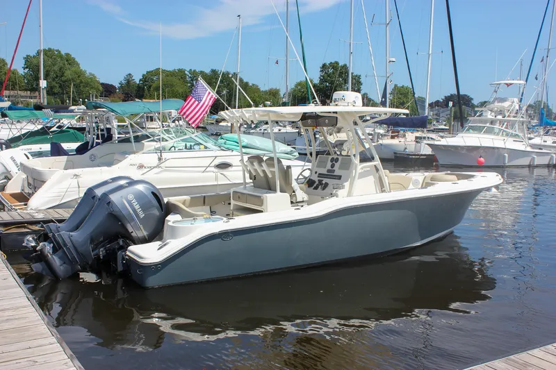The Image of 2022 Key West 263 FS boat docked in marina, featuring Yamaha outboard motor. - 0