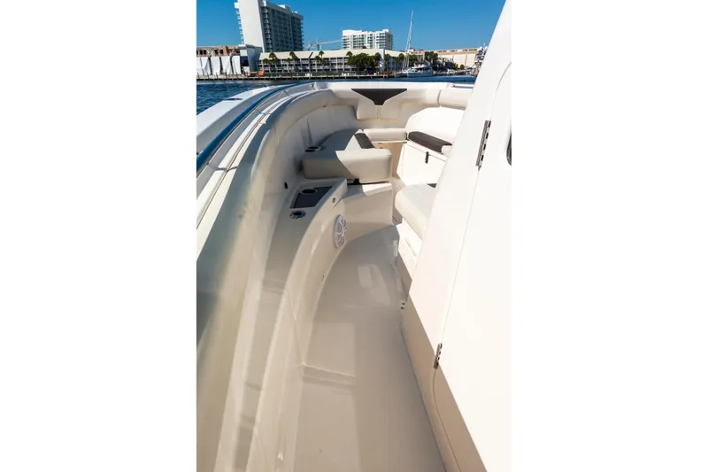 Slide: The Image of 2027 Sailfish 312 CC boat interior with seating and ocean view. - 14