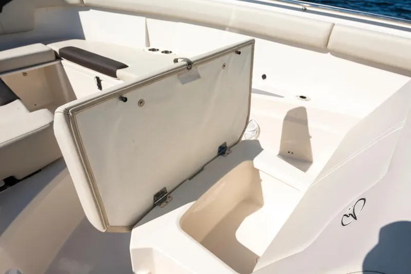 Slide: The Image of 2027 Sailfish 312 CC boat interior with open storage compartment. - 18
