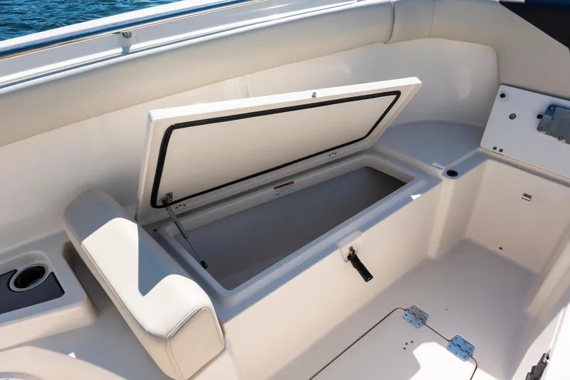 Slide: The Image of Open storage compartment on 2027 Sailfish 312 CC boat deck. - 19