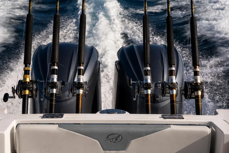 Slide: The Image of Fishing rods on a 2027 Sailfish 312 CC boat with dual engines in motion. - 27