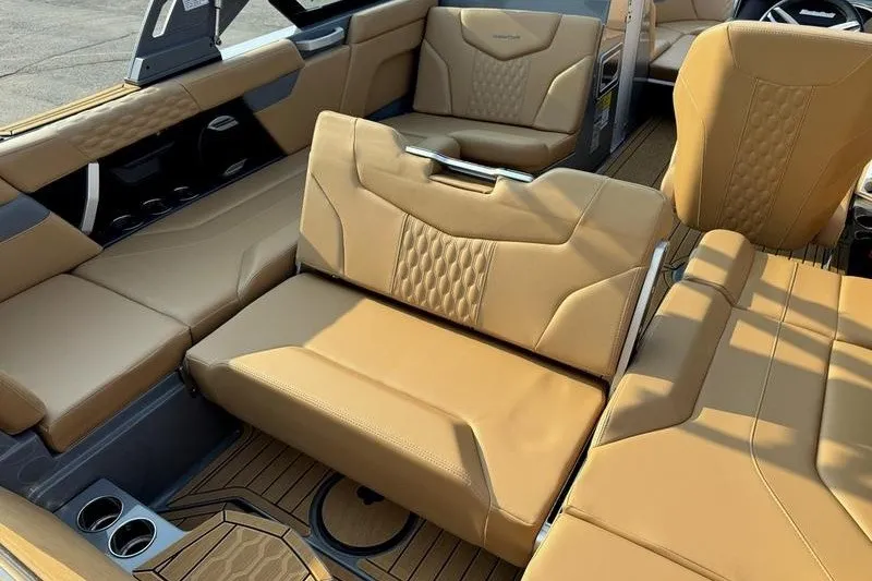 Slide: The Image of Luxurious interior of 2026 MasterCraft XT23 boat with tan leather seating. - 3