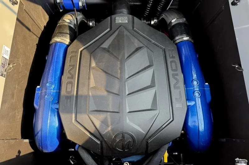 Slide: The Image of Engine of 2026 MasterCraft XT23 boat with Ilmor branding and blue components. - 17
