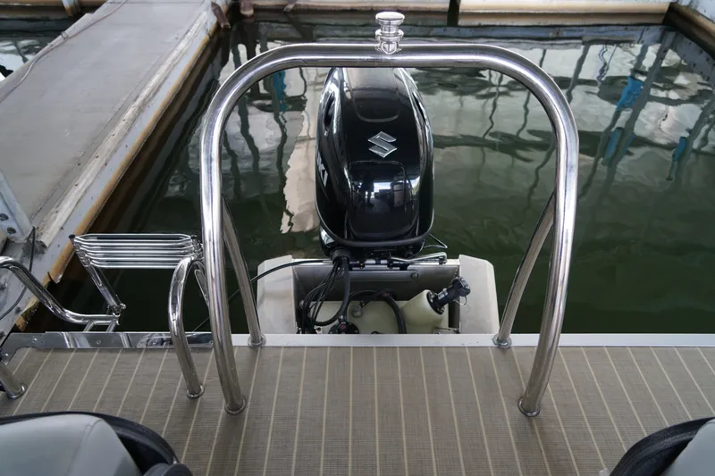 Slide: The Image of 2024 Lexington Palm Breeze Emerg boat with Suzuki outboard motor in dock. - 15