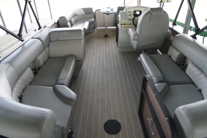 Slide: The Image of Luxurious interior of 2024 Lexington Palm Breeze Emerg pontoon boat with plush seating. - 9