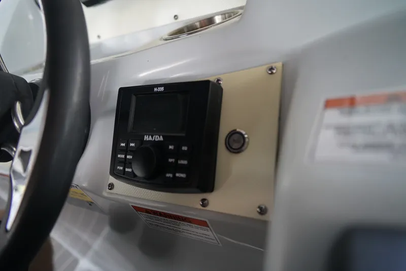 Slide: The Image of 2024 Lexington Palm Breeze Emerg dashboard with steering wheel and control panel. - 16