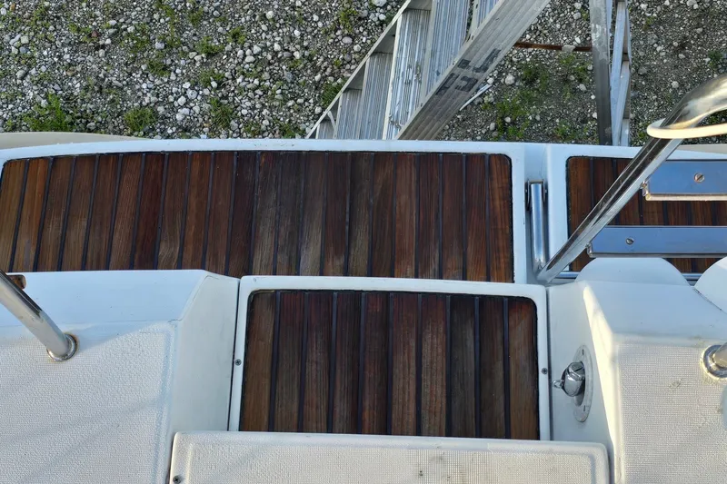 Slide: The Image of Teak deck of 1997 Beneteau Oceanis 36 CC sailboat with metal railings. - 10