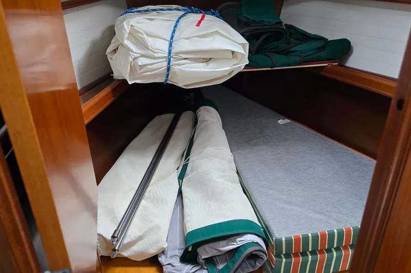 Slide: The Image of Interior storage of 1997 Beneteau Oceanis 36 CC sailboat with sails and equipment. - 22