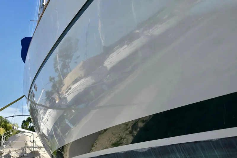 Slide: The Image of Close-up of a 1997 Beneteau Oceanis 36 CC yacht hull reflecting surroundings. - 6