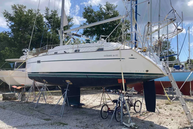 Slide: The Image of 1997 Beneteau Oceanis 36 CC sailboat on stands, ready for maintenance. - 5