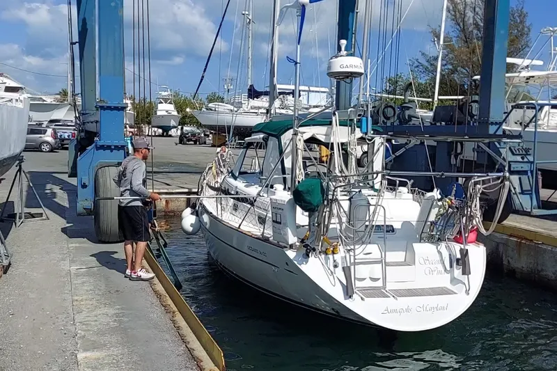 Slide: The Image of Beneteau Oceanis 36 CC sailboat from 1997 being docked at a marina. - 1