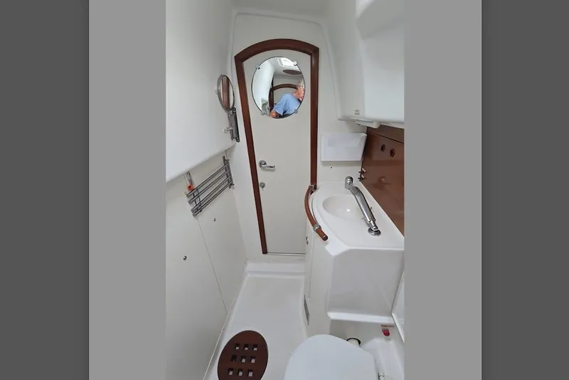 Slide: The Image of Interior of 1997 Beneteau Oceanis 36 CC yacht bathroom with sink and toilet. - 21