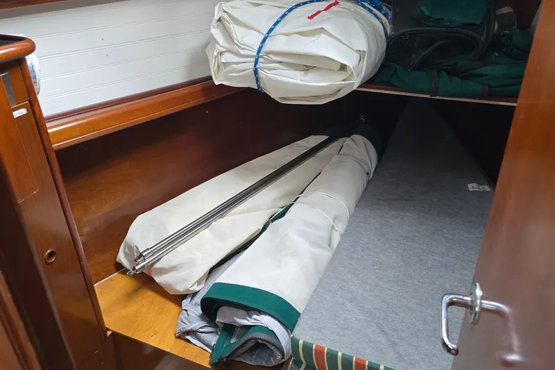Slide: The Image of Storage compartment in a 1997 Beneteau Oceanis 36 CC sailboat with sails and equipment. - 23