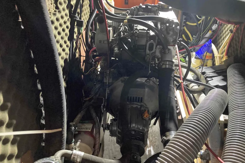 Slide: The Image of Engine compartment of a 1997 Beneteau Oceanis 36 CC sailboat, showing mechanical components. - 26