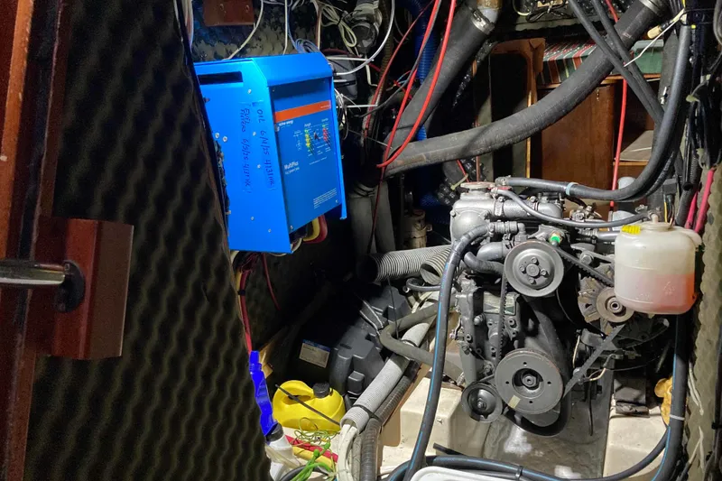 Slide: The Image of Engine room of a 1997 Beneteau Oceanis 36 CC sailboat, featuring mechanical components and wiring. - 25