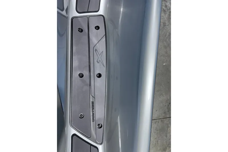 Slide: The Image of Close-up of 2026 Sea-Doo RXP-X 325 footrest with logo and textured surface. - 19