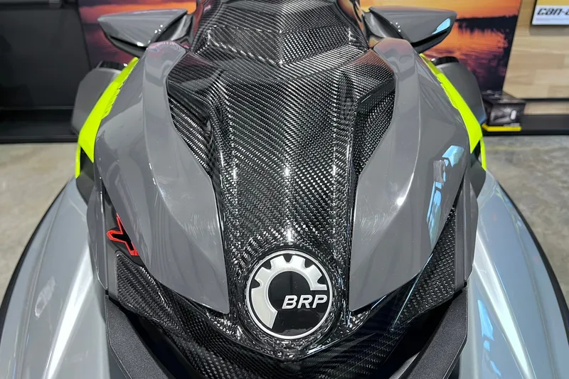 Slide: The Image of 2026 Sea-Doo RXP-X 325 with sleek carbon fiber design and BRP logo. - 26