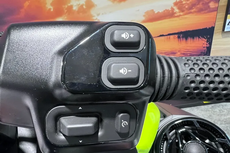 Slide: The Image of Close-up of 2026 Sea-Doo RXP-X 325 handlebar controls with sunset background. - 17