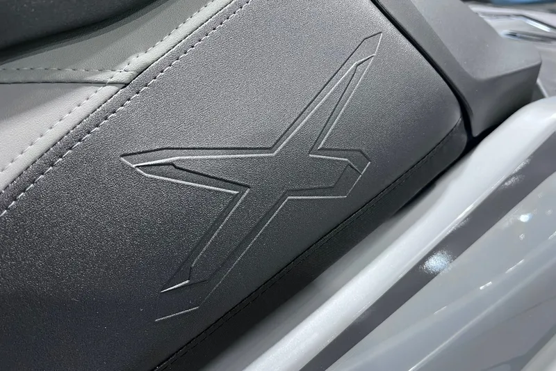 Slide: The Image of Close-up of 2026 Sea-Doo RXP-X 325 seat with embossed "X" design. - 20