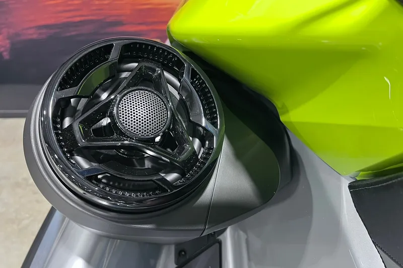 Slide: The Image of Close-up of 2026 Sea-Doo RXP-X 325 speaker detail with vibrant green body. - 18