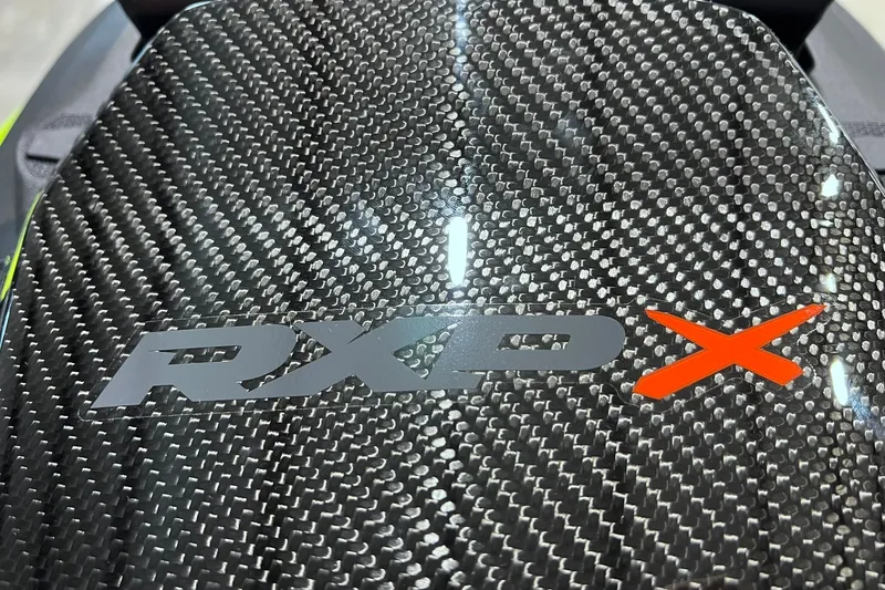 Slide: The Image of 2026 Sea-Doo RXP-X 325 with carbon fiber finish and bold logo design. - 24