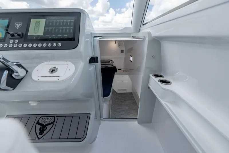 Slide: The Image of Interior view of 2026 Toro Yachts Toro 42, featuring modern cockpit and cabin entrance. - 55