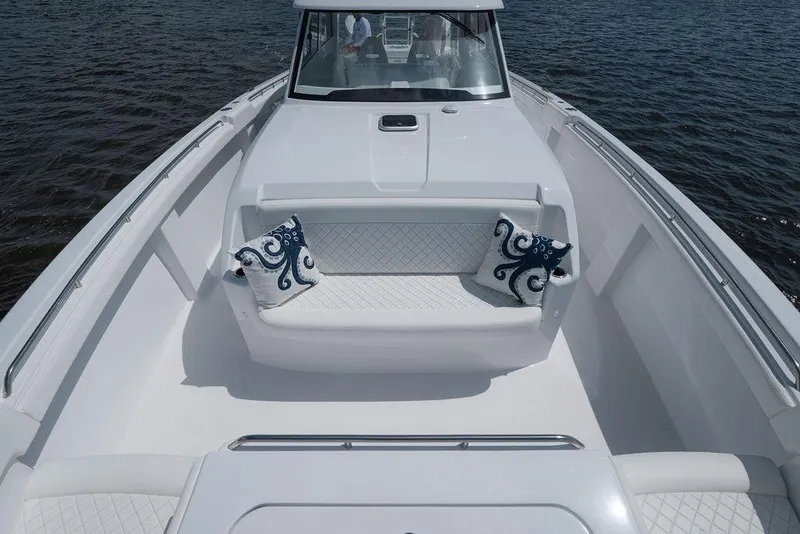 Slide: The Image of Luxurious 2026 Toro Yachts Toro 42 with elegant seating and nautical-themed cushions on open water. - 34