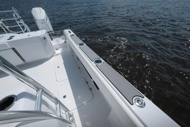 Slide: The Image of 2026 Toro Yachts Toro 42 boat deck with sleek design on open water. - 29